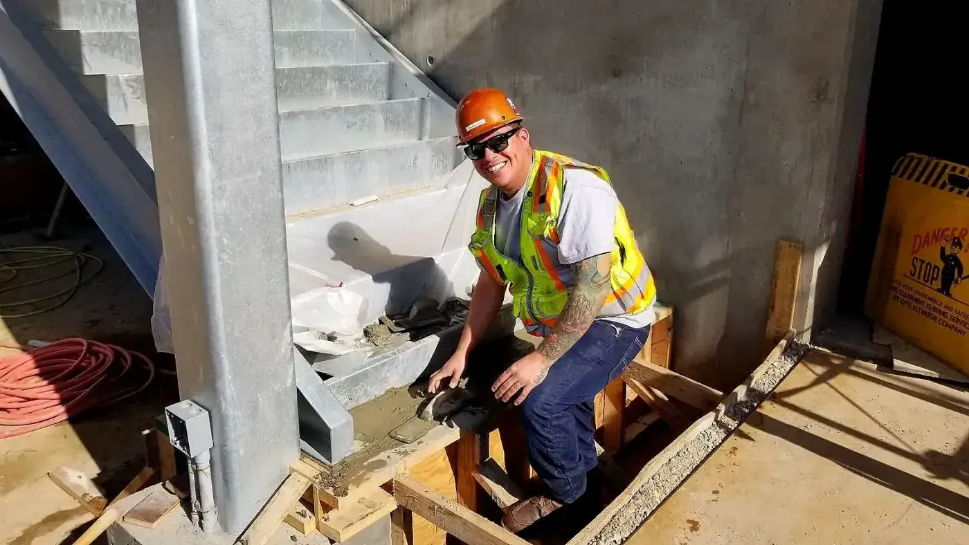 Hands On Labor worker in hardhat on construction site